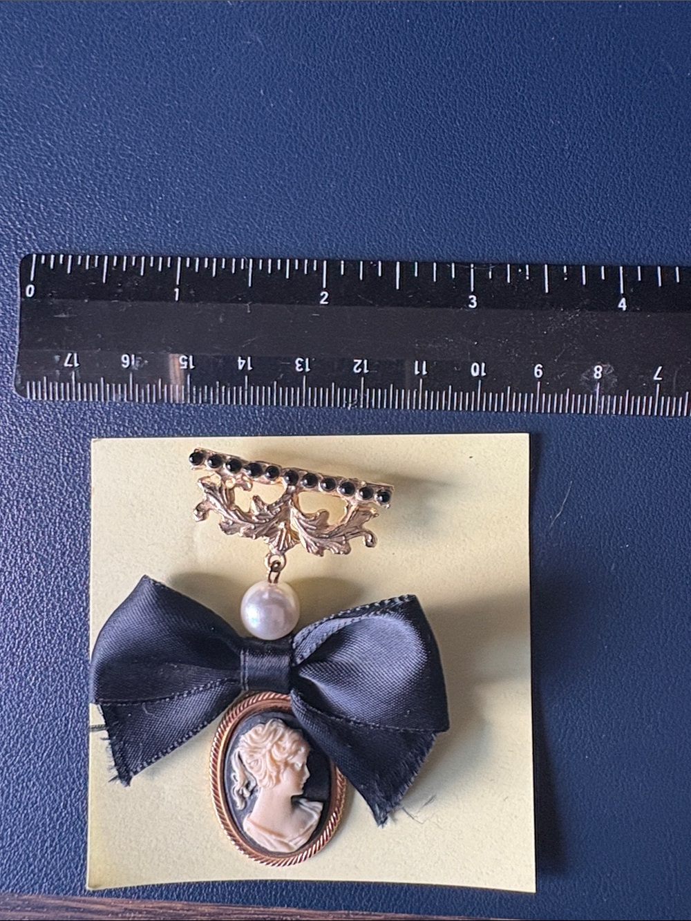 Vintage-Inspired Black Ribbon Cameo Brooch with Pearl Accent